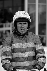 A mud splattered A P McCoy at Worcester races A mud splattered A P McCoy at Worcester races