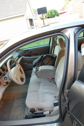 Backpack with computer and gaming supplies sitting in the honored position of shotgun