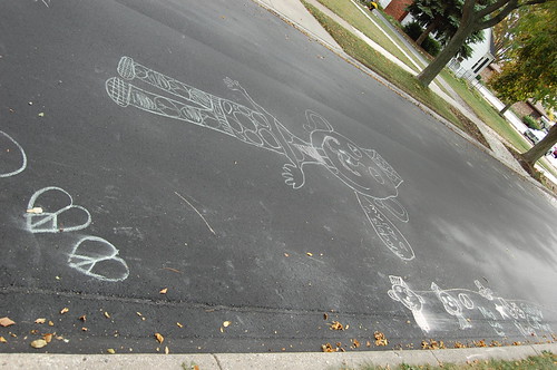 chalk drawings in the newly paved road