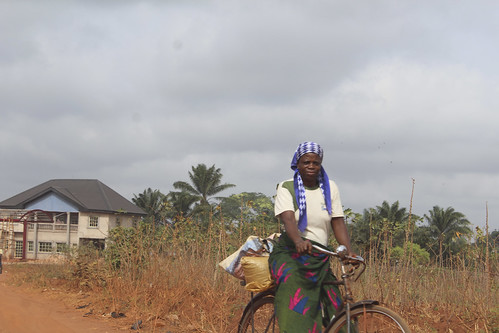 Igbo Mother Riding Her Bicycle by Jujufilms