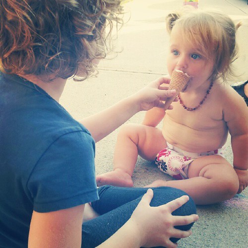 Baby's first ice cream cone. Best big sister ever.