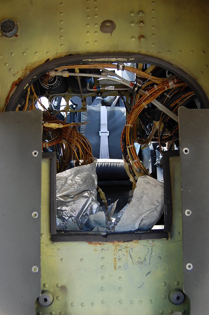 looking up through wires to seat and harness for pilot