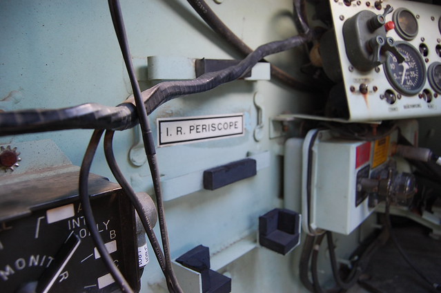drab green interior of restored armored personnel carrier with IR labeled.