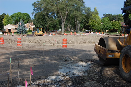 Street torn up and round circle of dirt being formed