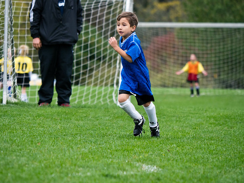 Logan playing soccer by john m flores