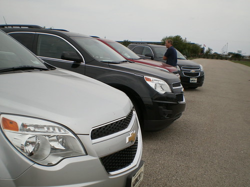 Mike looking in row of 2013 Chevys