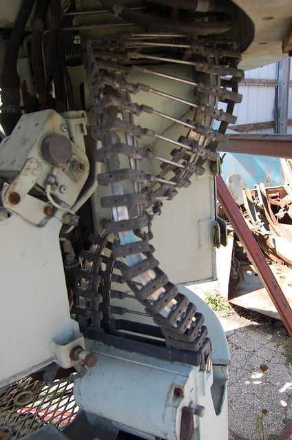 metal helix elevator that carried ammo from storage box to feed gun