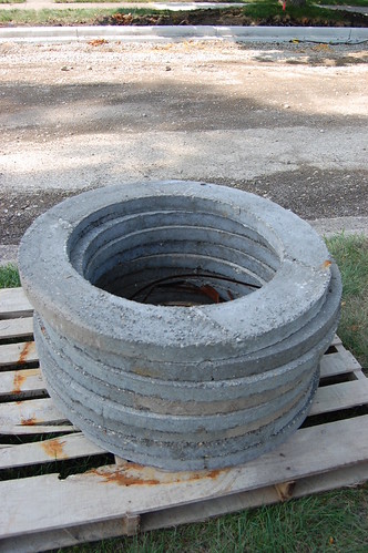 stack of cement forms for manhole rings