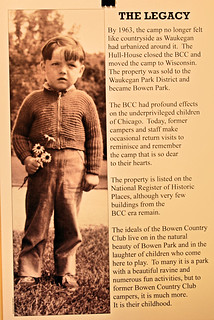 Information poster shows a young boy from the 30s in a zippered sweater and dungarees holding a small bouquet of wildflowers
