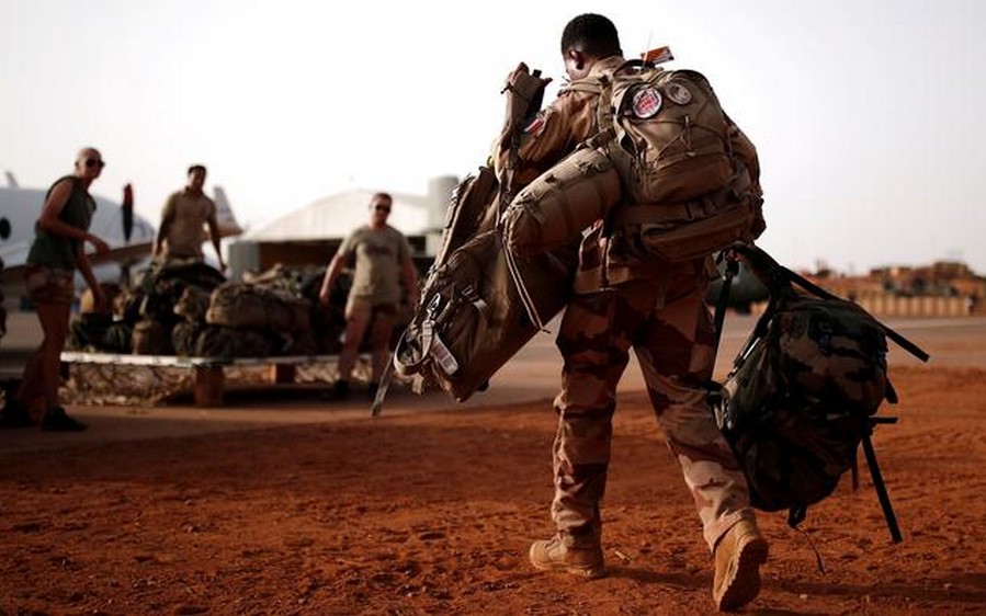 FILE PHOTO: A French soldier leaves with his backpack at the Operational Desert Platform Camp (PfOD) during the Operation Barkhane in Gao