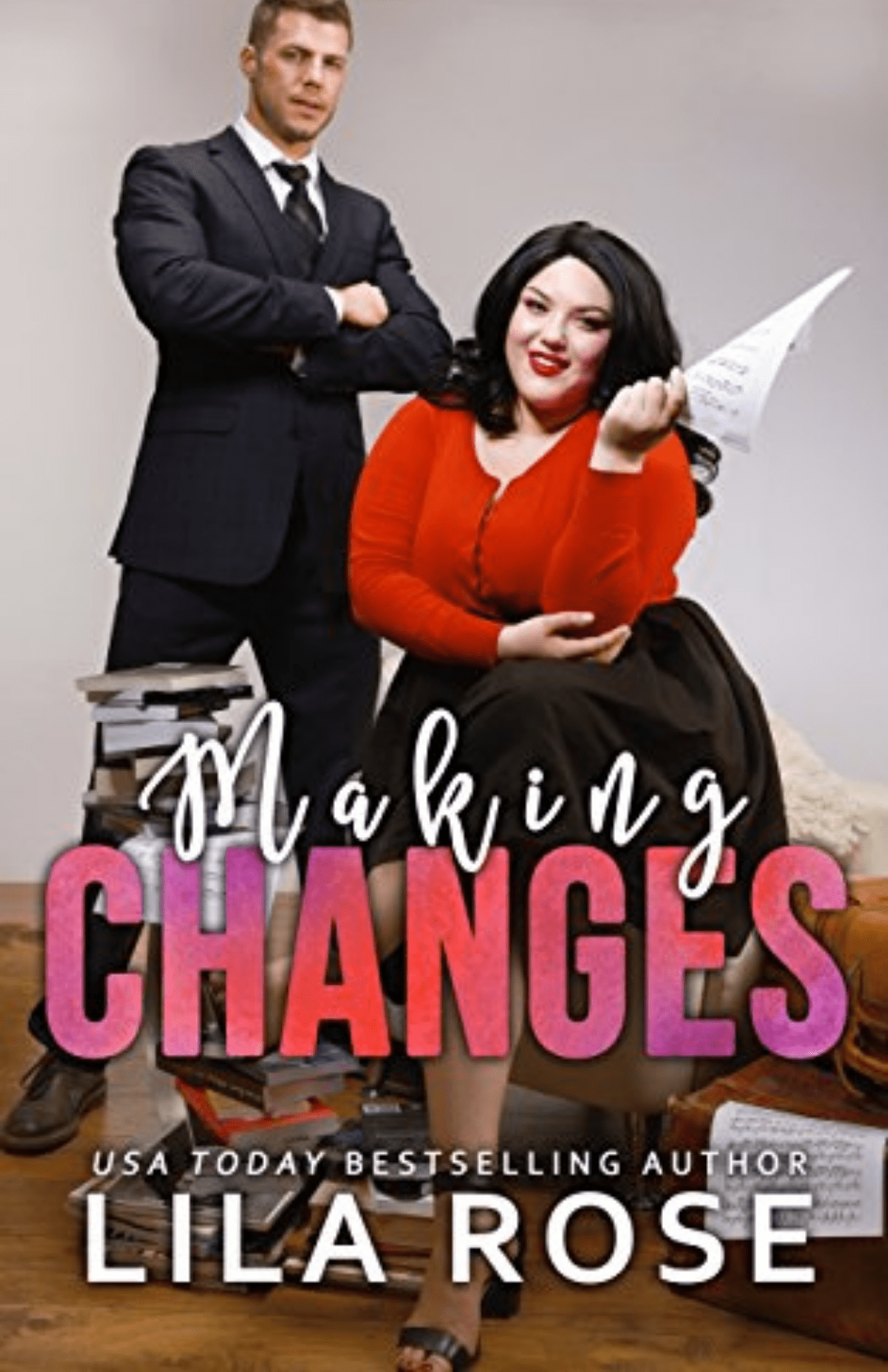 Book Cover: A fat woman with shoulder length black hair and a red blouse with black skirt in a chair holding some papers. Behind her a handsome blonde man in a business suit stands with crossed arms. Books are piled on the floor and tables around them. Making Changes by Lila Rose