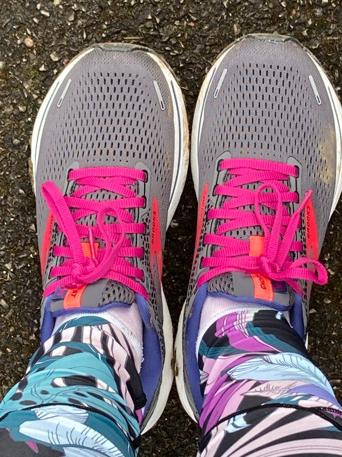 A new pair of grey brooks Ghost trainers with pink shoe laces.