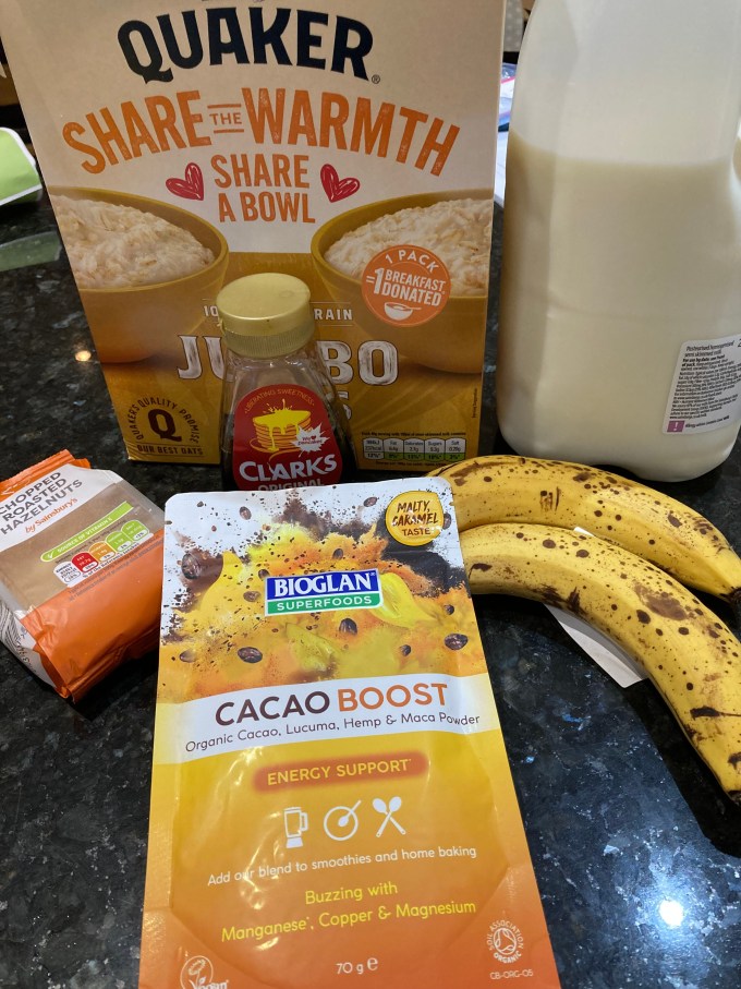 Porridge oats, milk, chopped hazel nuts, bananas and Bioglan superfoods cacao boost.