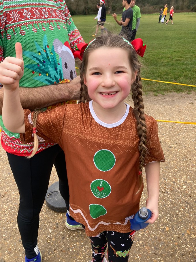 M giving a thumbs up sign at the end of parkrun.