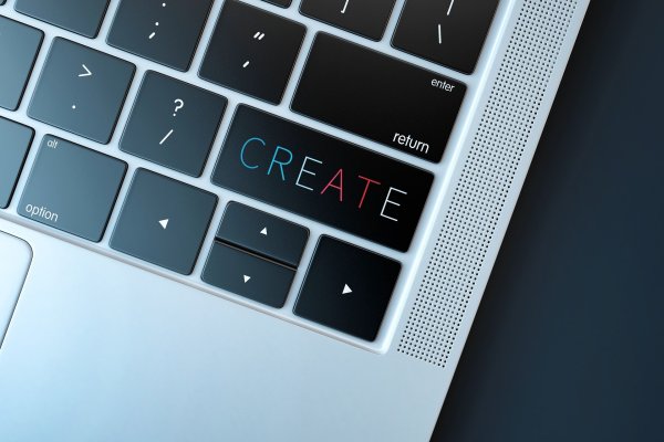 A close-up of a laptop keyboard with a button reading, "Create" in rainbow letters underneath the "Enter" key. Image via Pixabay.