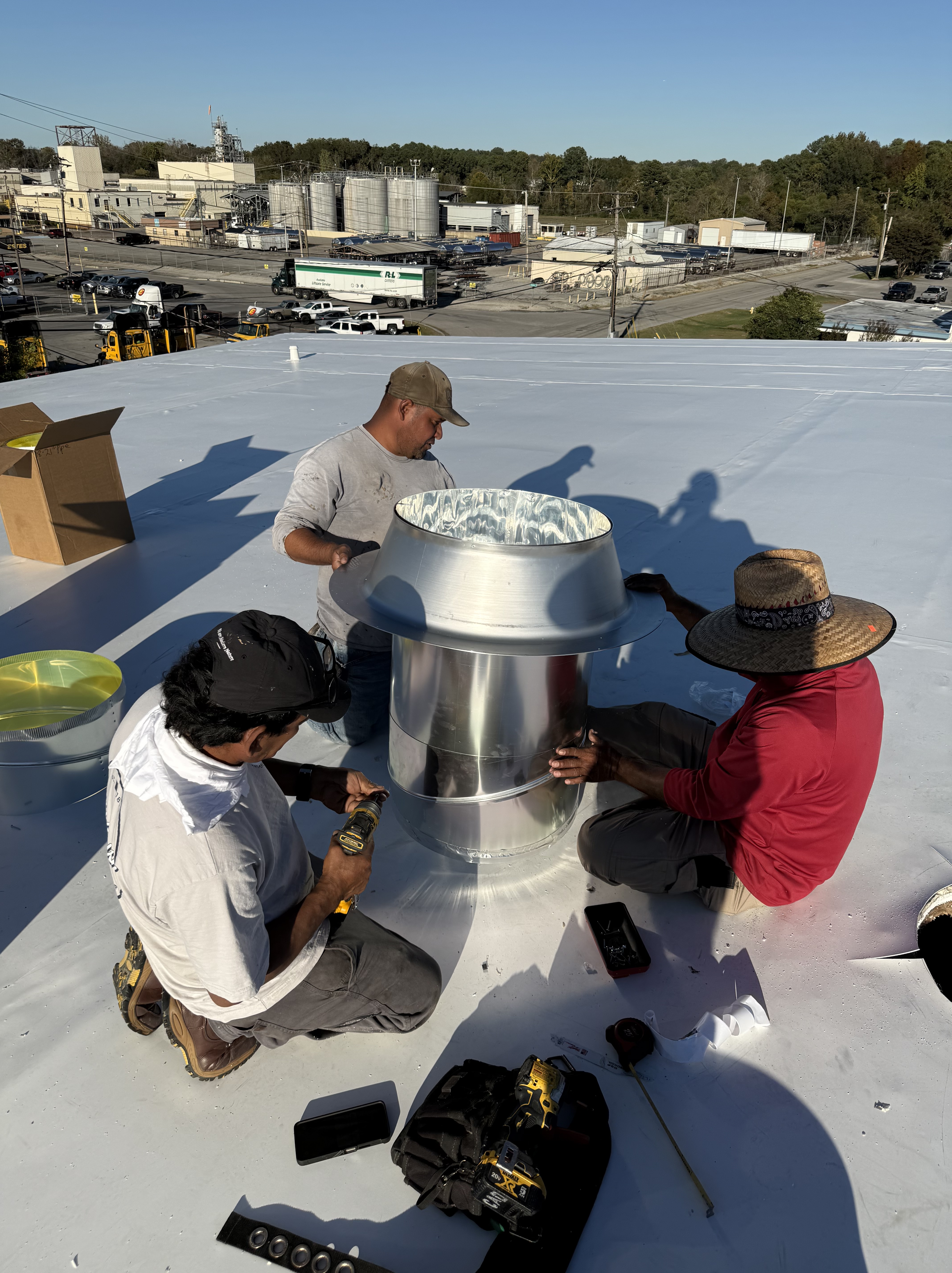 First Class Roofing commercial crew on a flat roof
