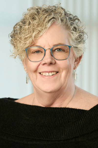 A close-up of Mary-Beth smiling at the camera.