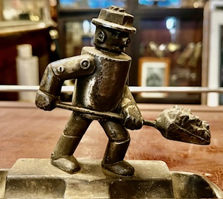 Detail of collectible U.S. Art Deco 'Iron Fireman' two well ashtray, likely manufactured by A.C. Rehberger Co. Chicago 1930/1940s. Machine age robot shovelling coal promotional mascot for the Iron Fireman Manufacturing Compa ny's automatic caol stokers, given away as promotional advertising gifts by salesmen, H 11.5cm x W 16.5cm x D 11cm (RR265) $145 salvaged vintage recycled, demolition, reproduction, restoration, home renovation secondhand, used , original, old, reclaimed, heritage, antique, victorian, art nouveau edwardian georgian art deco