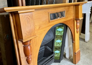 Detail of arched polished slim mantel with geometric carving on legs and breastplate with split turnings and bevelled mirror, top shelf W 1535 x D 155mm, height 1220mm, outer leg 1350mm, opening W 910 x H 930mm (M336) $445 salvaged vintage recycled, demolition, reproduction, restoration, home renovation secondhand, used , original, old, reclaimed, heritage, antique, victorian, art nouveau edwardian georgian art deco