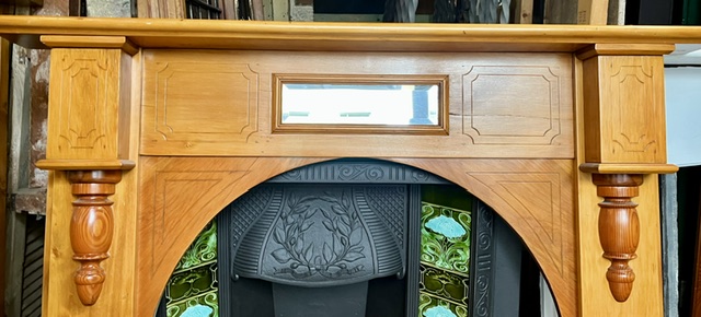 Detail of arched polished slim mantel with geometric carving on legs and breastplate with split turnings and bevelled mirror, top shelf W 1535 x D 155mm, height 1220mm, outer leg 1350mm, opening W 910 x H 930mm (M336) $445 salvaged vintage recycled, demolition, reproduction, restoration, home renovation secondhand, used , original, old, reclaimed, heritage, antique, victorian, art nouveau edwardian georgian art deco