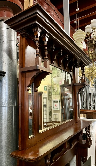 Overmantel detail of Edwardian polished original timber mantel with matching overmantel mirror, canopy 1560 x 215mm, shelf 1600 x 350mm, height overall 2365mm, outer leg 1445mm, opening W 1050 x H 935mm (M340) $1200 salvaged vintage recycled, demolition, reproduction, restoration, home renovation secondhand, used , original, old, reclaimed, heritage, antique, victorian, art nouveau edwardian georgian art deco