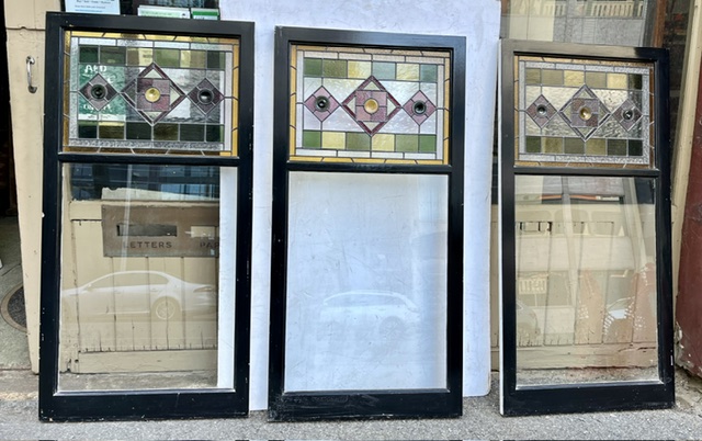 Rear of trio of geometric leadlight and fixed glass timber frame windows, in pinks and greens, each window frame H 1600mm x W 795mm, leadlight H 485 x W 670mm, glass H 895 x W 670mm (LL394) $445 each salvaged vintage recycled, demolition, reproduction, restoration, home renovation secondhand, used , original, old, reclaimed, heritage, antique, victorian, art nouveau edwardian georgian art deco