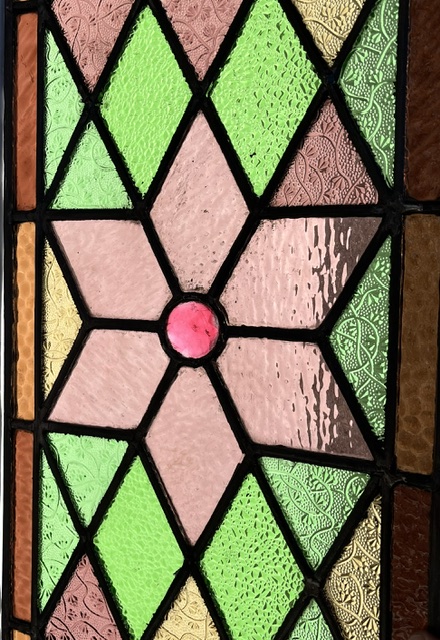Detail of pair of original restored geometric leadlight panels, central pink star design with pink, cerise, yellow and green textured diamond panes, each panel is 1090 x 310mm (LL401 FT) $875 PAIR salvaged, vintage recycled, demolition, reproduction, restoration, home renovation secondhand, used , original, old, reclaimed, heritage, antique, victorian, art nouveau edwardian, georgian, art deco
