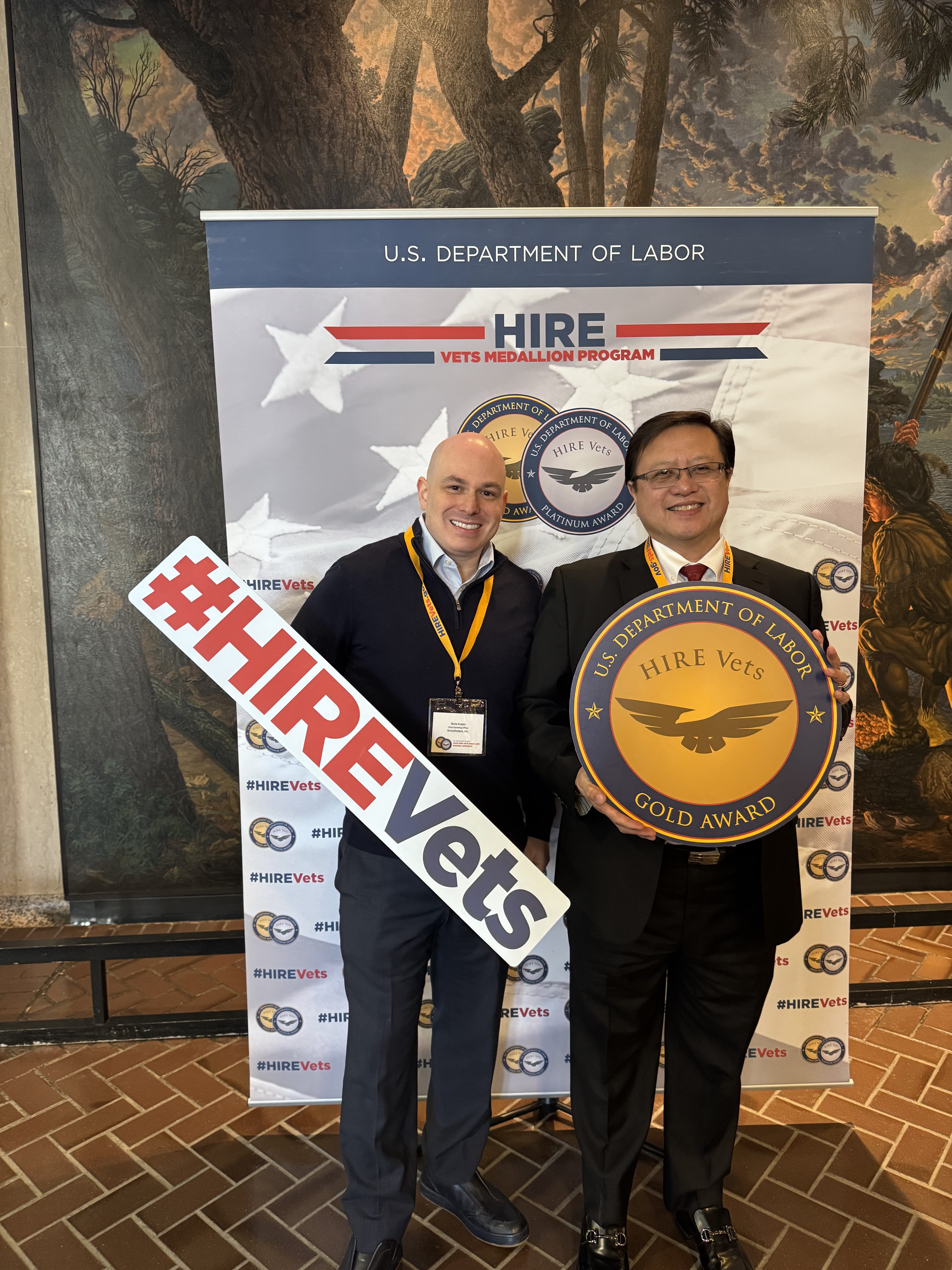 Fedstack leadership accepting the U.S. Department of Labor HIRE Vets Gold Medallion Award