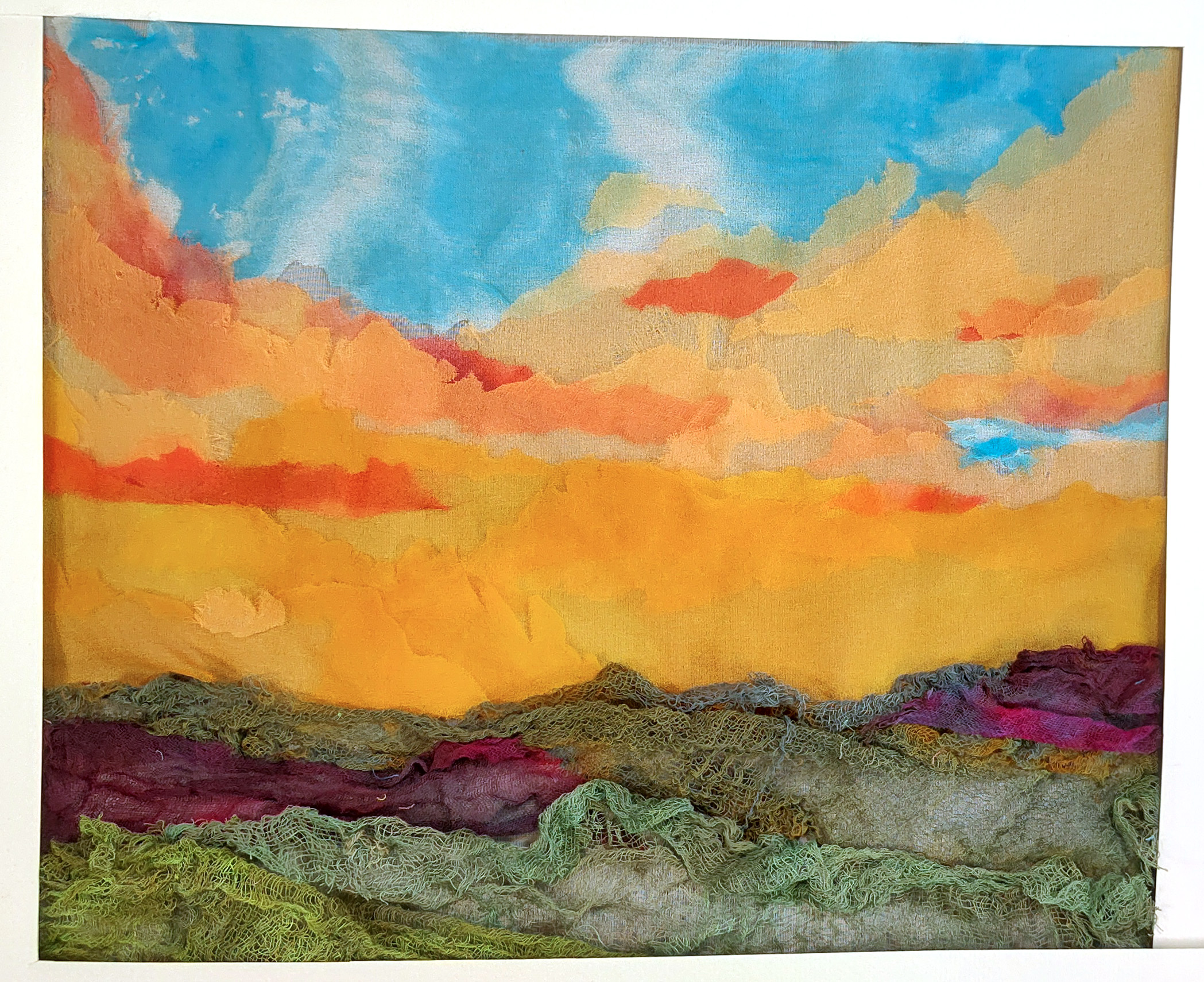 Landscape laid out with silk scraps and cheesecloth