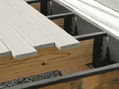 Decking boards laying on top of protective membrane