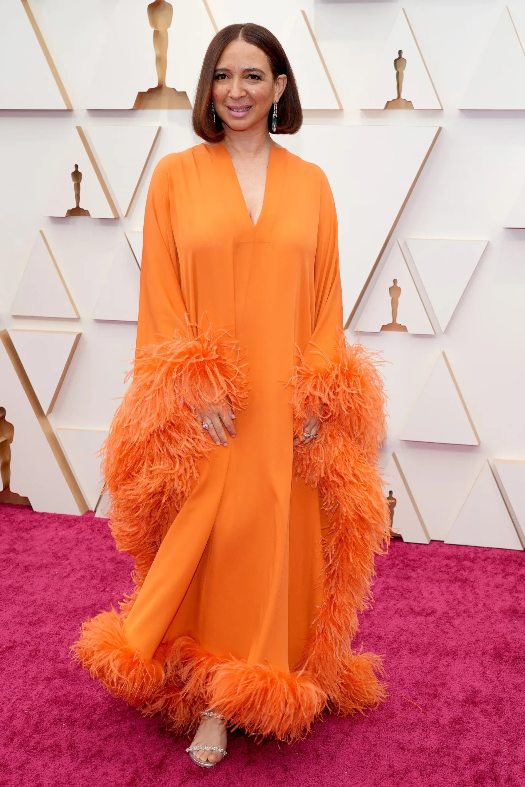 Maya Rudolph in orange feathered gown 