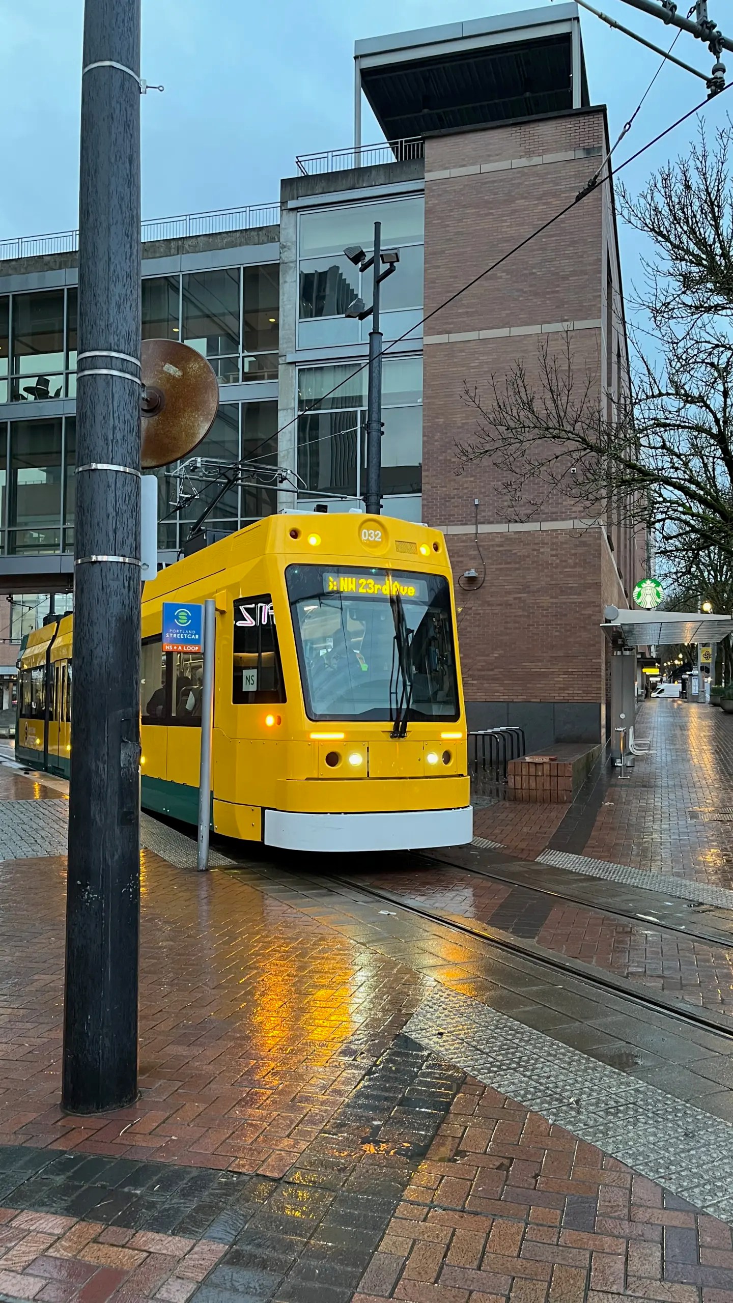 Photo of Portland Streetcar 032 as it prepares to depart PSU Urban Center in revenue service for the first time.
