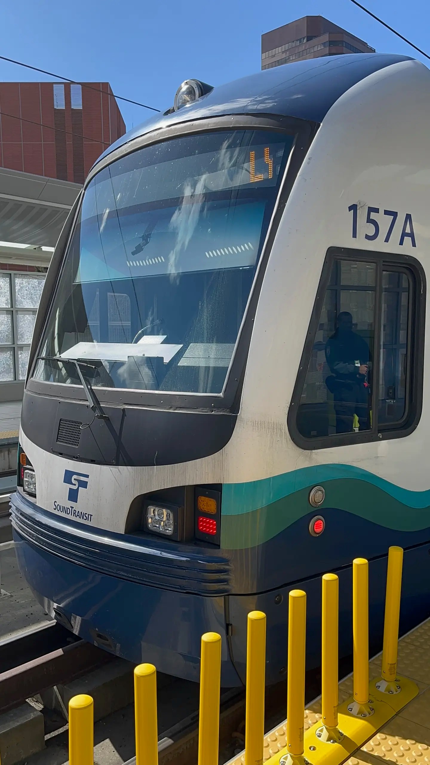 Photo of Sound Transit Link car 157 arriving southbound at Bellevue Downtown on opening day of the Crosslake Connection.