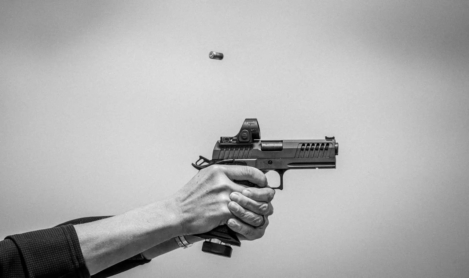 hand-holding-fierce-grizz-gz9-and-spent-casing-in-air