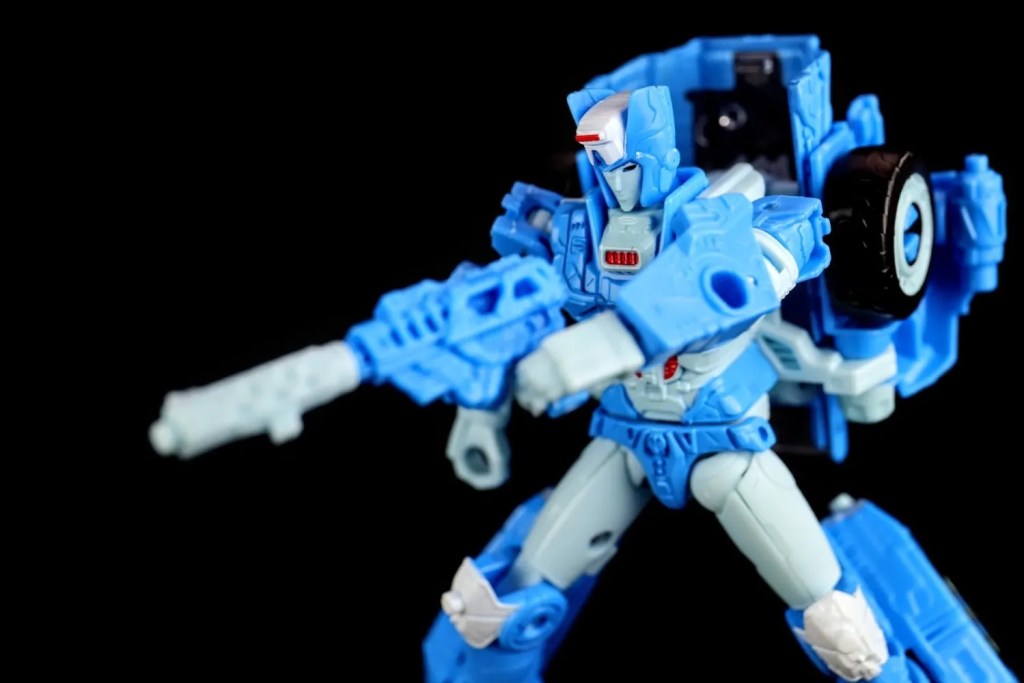 Hasbro Transformers Siege Chromia Deluxe Class posed with blaster weapon