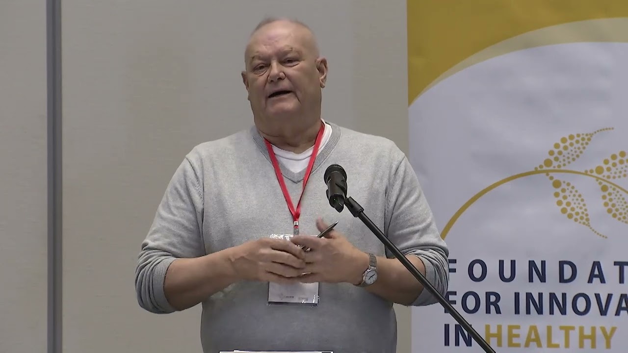Man speaking at a podium during an FIHF event