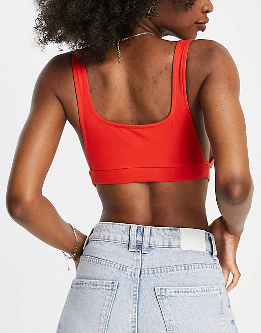 Brands that don't retouch their models. This unretouched model is wearing a red crop top from ASOS