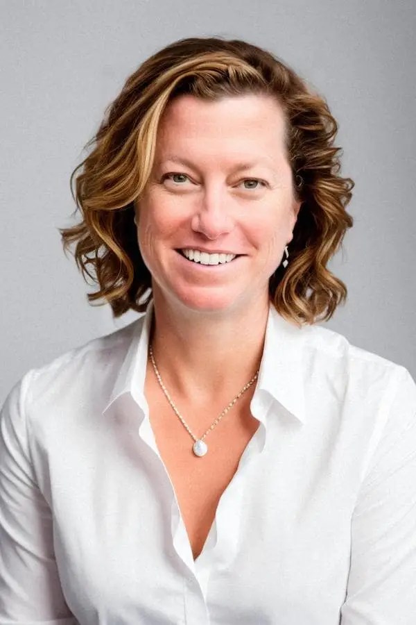 Dr Jill Rubinstein wearing white shirt smiling at the camera