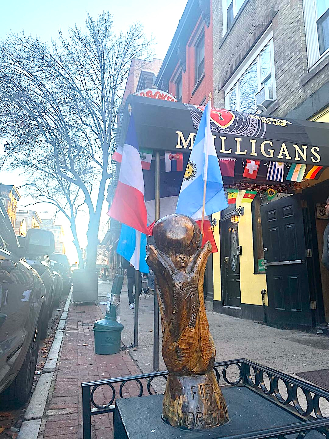 wood carving of World Cup trophy outside Mulligan's soccer pub in Hoboken