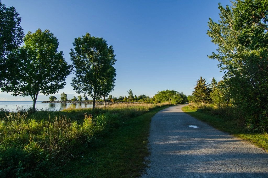A view of the walking path beside the waterline at Colonel Samuel Smith Park in Toronto, Ontario, Canada.