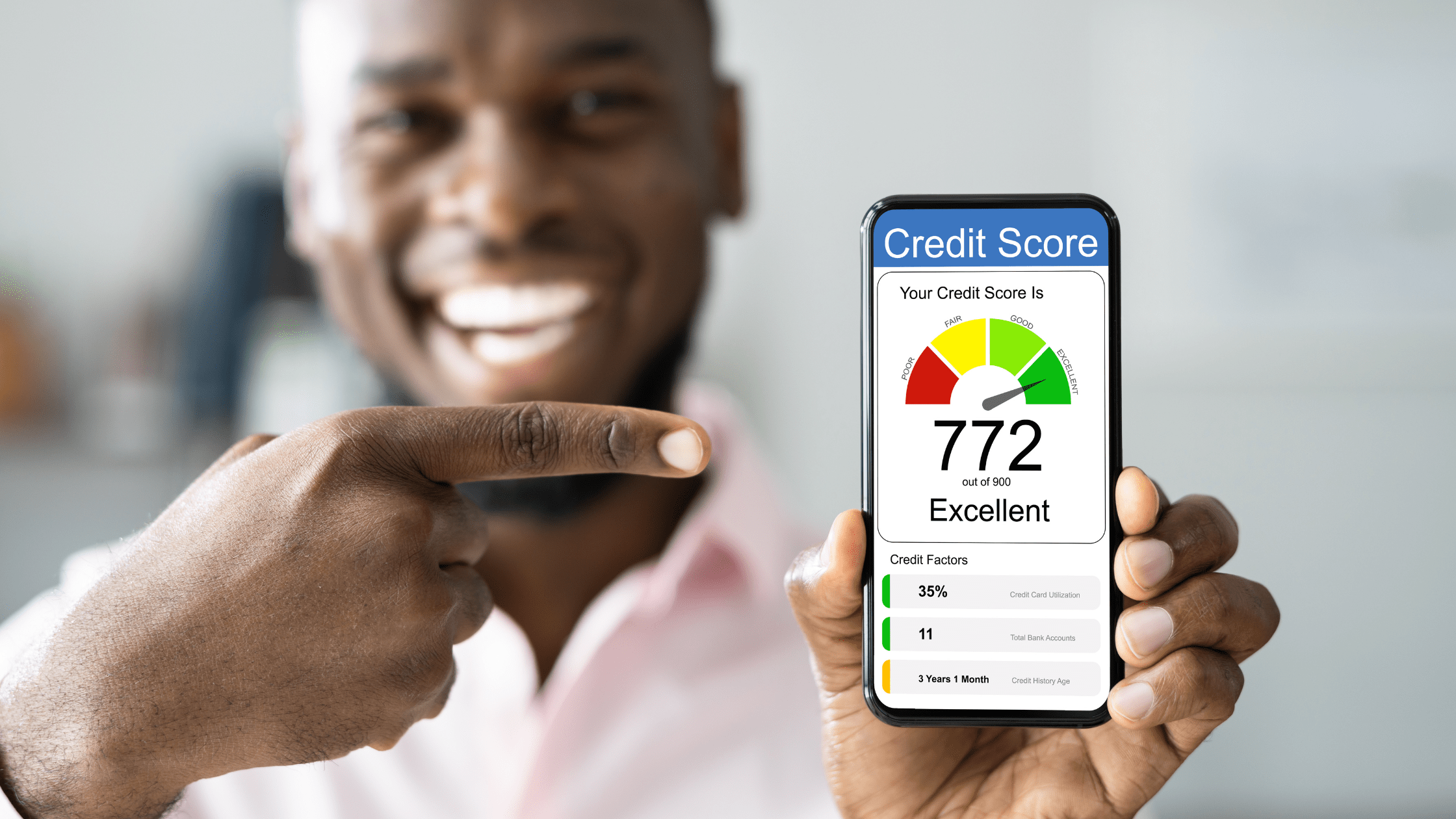 Person checking their rising credit score on a phone at home