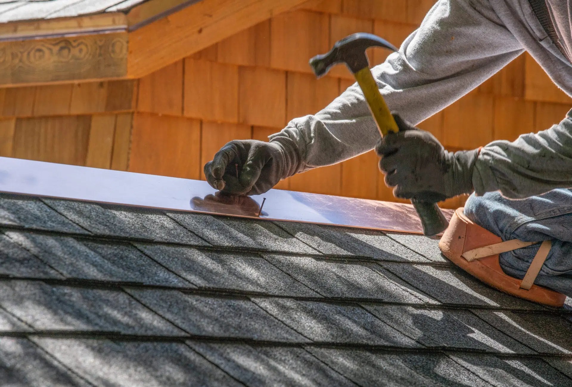 Roofer repairing a roof leak in Charlotte NC