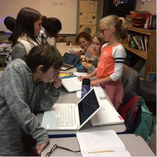 FALA direct needs donations photo featuring young students working with technology