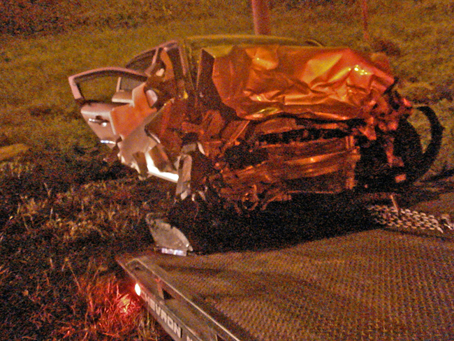 The compact as it was being pulled out of the ditch. (c FlaglerLive)