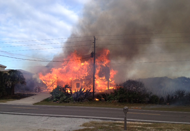 The house at 3519 North A1A was fully engulfed in flames when firefighters arrived Sunday afternoon. (Flagler County Fire Rescue)