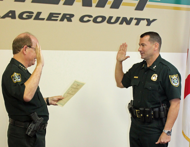 Jeff Hoffman, right, is sworn in by Sheriff Jim Manfre today. (FCSO)