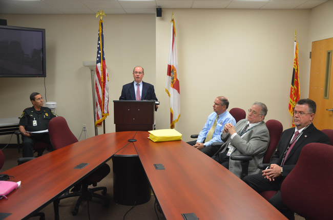 Bob Weber was to the left of Jim Manfre on the eve of the new administration's take-over, as Manfre announced impending changes and his new top team, which includes Undersheriff Rick Staly, in the light blue shirt, Human Resources Director Robert Crouse, to whom Debbie Johnson addressed her grievance, and Jack Bisland, the new head of the investigative division. (© FlaglerLive)