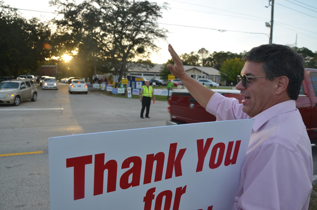 Nate McLaughlin as the sun set on the last day of Incumbent County Commissioner the 2014 campaign. (© FlaglerLive)