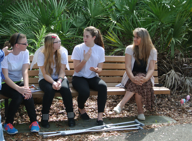 Erin Robinson, third from left, talked with her fellow Guardian Angels at Palm Coast's memorial garden Monday. She was with Indian Trails students Olivia Reynolds and Cristina Cabada, and teacher Dana Hausen. (Palm Coast)