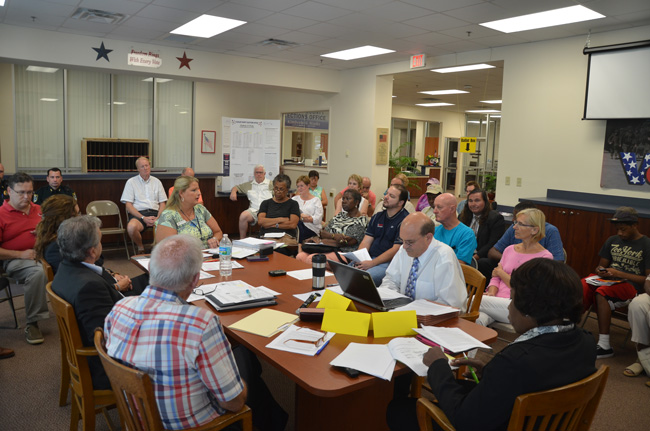 Supervisor of Elections Kimberle Weeks, at the head of the table, addressing the audience, as she did numerous times Friday, during what was intended to be a Canvassing Board meeting. (c FlaglerLive)